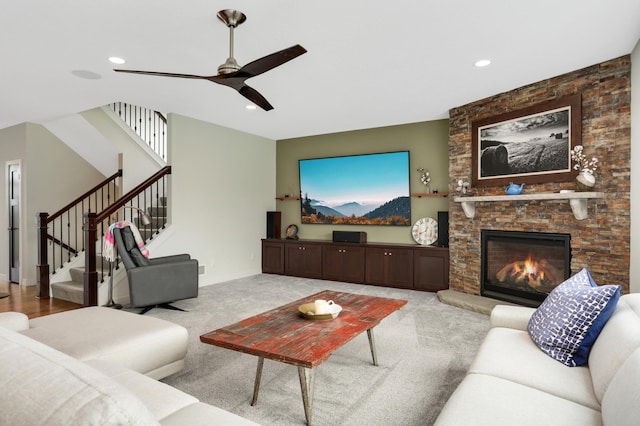 4965 250th St, Elko New Market, MN 55020 - carpeted living room with a ceiling fan, stairs, recessed lighting, and a stone fireplace