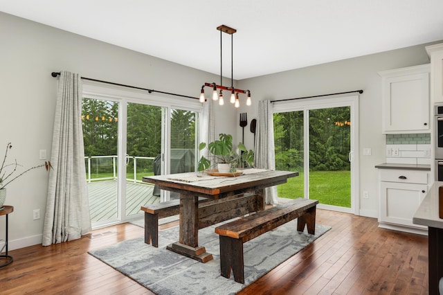 4965 250th St, Elko New Market, MN 55020 - dining area featuring hardwood / wood-style flooring and a chandelier