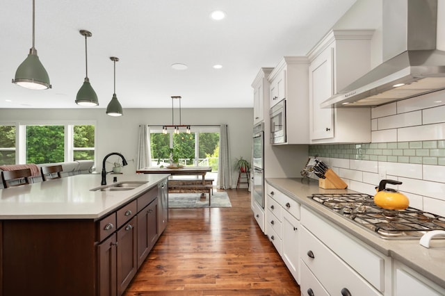 4965 250th St, Elko New Market, MN 55020 - kitchen featuring wall chimney exhaust hood, appliances with stainless steel finishes, white cabinetry, dark wood-style floors, and recessed lighting