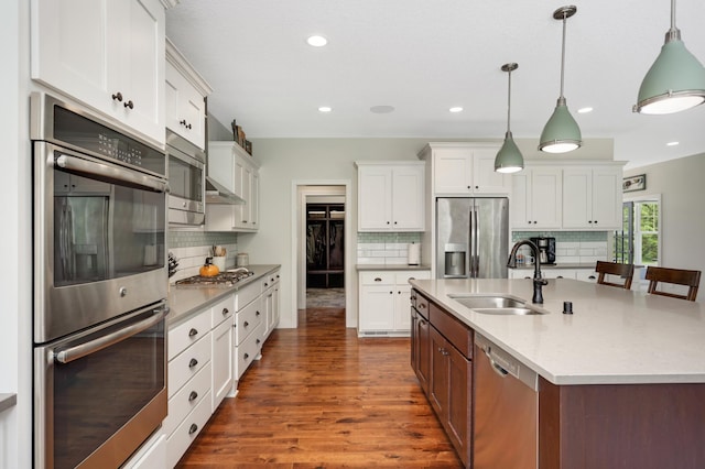 4965 250th St, Elko New Market, MN 55020 - kitchen featuring stainless steel appliances, dark wood-style floors, tasteful backsplash, white cabinets, and recessed lighting