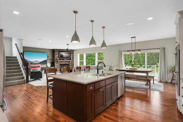 4965 250th St, Elko New Market, MN 55020 - kitchen with dishwasher, dark wood-style flooring, a stone fireplace, light countertops, and recessed lighting