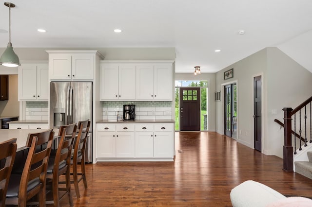 4965 250th St, Elko New Market, MN 55020 - kitchen with stainless steel fridge with ice dispenser, dark wood-type flooring, decorative backsplash, hanging light fixtures, and recessed lighting