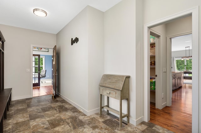 4965 250th St, Elko New Market, MN 55020 - hallway with baseboards and stone finish flooring