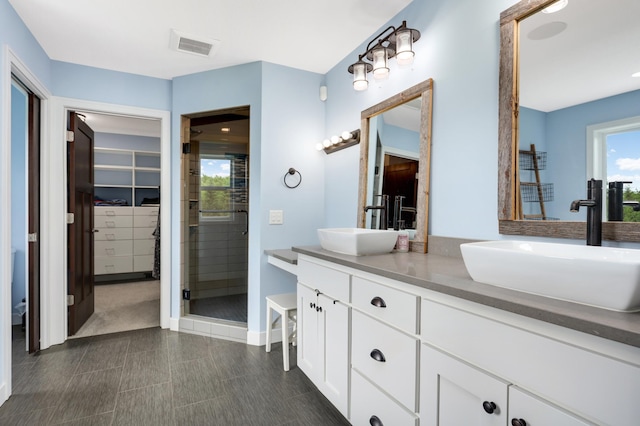 4965 250th St, Elko New Market, MN 55020 - full bath with double vanity, a stall shower, and a spacious closet