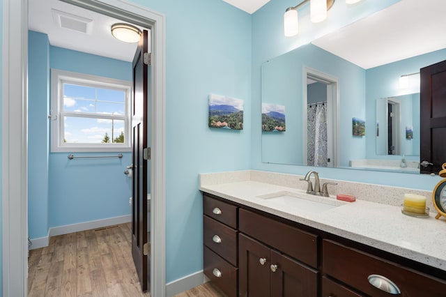 4965 250th St, Elko New Market, MN 55020 - full bath featuring vanity and wood finished floors