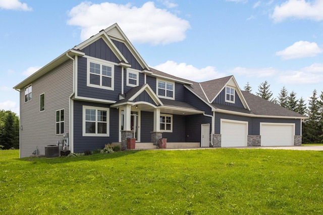 4965 250th St, Elko New Market, MN 55020 - craftsman inspired home featuring board and batten siding, a front lawn, driveway, and a garage