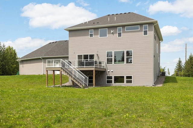 4965 250th St, Elko New Market, MN 55020 - back of property with a wooden deck, stairway, and a lawn