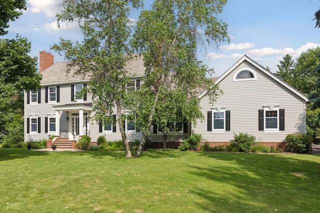 10636 Purdey Rd, Eden Prairie, MN 55347 - colonial-style house featuring a front lawn and a chimney