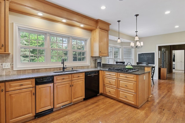 10636 Purdey Rd, Eden Prairie, MN 55347 - kitchen with dishwasher, stainless steel gas cooktop, a peninsula, light wood-style flooring, and backsplash