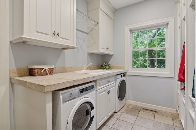 10636 Purdey Rd, Eden Prairie, MN 55347 - laundry room featuring washer / clothes dryer and cabinet space