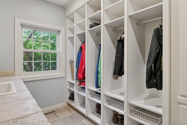 10636 Purdey Rd, Eden Prairie, MN 55347 - mudroom with light tile patterned floors and baseboards