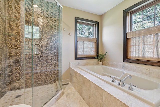 10636 Purdey Rd, Eden Prairie, MN 55347 - bathroom featuring a bath, a shower stall, and tile patterned floors