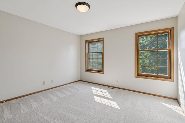 10636 Purdey Rd, Eden Prairie, MN 55347 - spare room with baseboards and light colored carpet