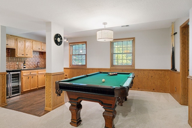 10636 Purdey Rd, Eden Prairie, MN 55347 - recreation room featuring beverage cooler, a wainscoted wall, bar with sink, carpet flooring, and pool table