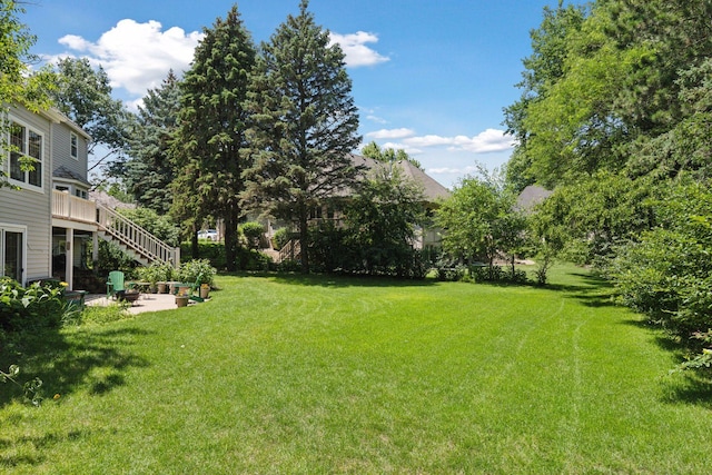 10636 Purdey Rd, Eden Prairie, MN 55347 - view of green lawn with a patio area, an outdoor fire pit, and stairway