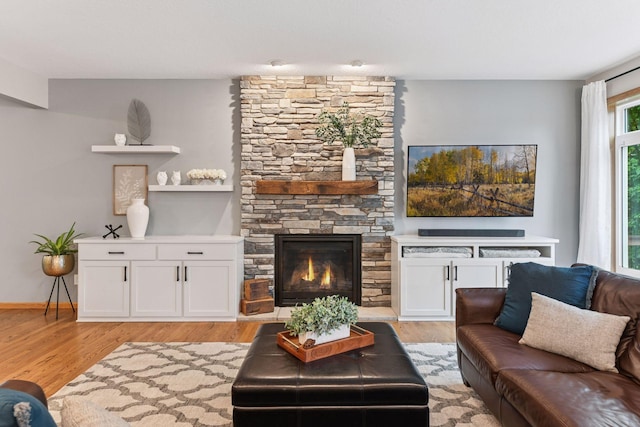 2061 Langston Ln NE, Saint Michael, MN 55376 - living room with light wood-style flooring and a stone fireplace