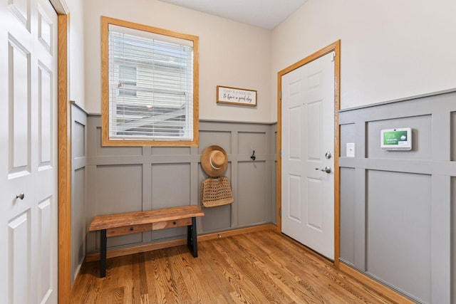 2061 Langston Ln NE, Saint Michael, MN 55376 - foyer entrance featuring a decorative wall, light wood-style flooring, and wainscoting