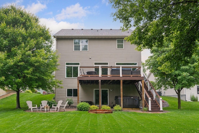 2061 Langston Ln NE, Saint Michael, MN 55376 - rear view of house featuring a hot tub, a wooden deck, a patio area, and a lawn