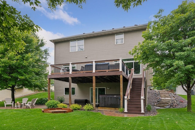 2061 Langston Ln NE, Saint Michael, MN 55376 - back of property featuring a hot tub, a deck, stairway, and a lawn