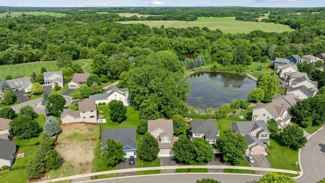 2061 Langston Ln NE, Saint Michael, MN 55376 - aerial perspective of suburban area with a nearby body of water and a heavily wooded area