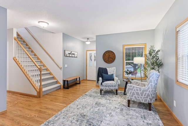 2061 Langston Ln NE, Saint Michael, MN 55376 - sitting room featuring stairs and wood finished floors