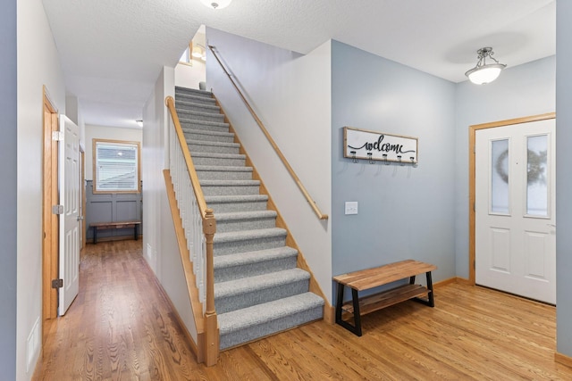 2061 Langston Ln NE, Saint Michael, MN 55376 - entryway featuring stairs and light wood-style floors