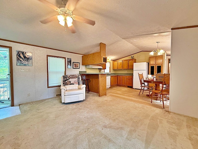45568 213th Ln, Aitkin, MN 56431 - kitchen featuring white appliances, a textured ceiling, brown cabinetry, a peninsula, and ceiling fan