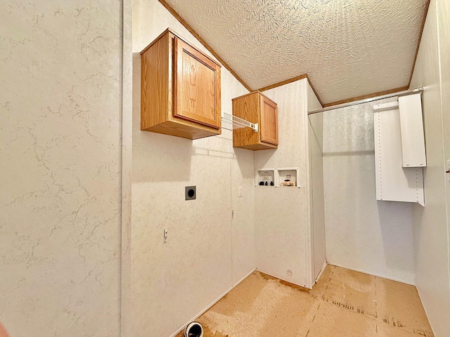 45568 213th Ln, Aitkin, MN 56431 - laundry area with cabinet space, a textured ceiling, hookup for an electric dryer, and washer hookup