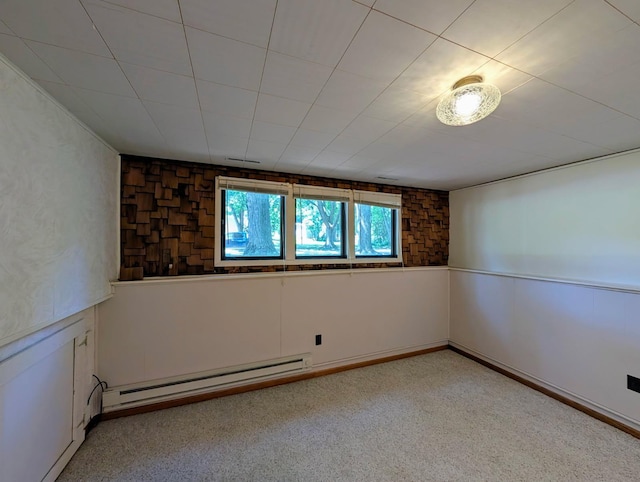 314 11th St, Montevideo, MN 56265 - spare room featuring baseboard heating and light colored carpet