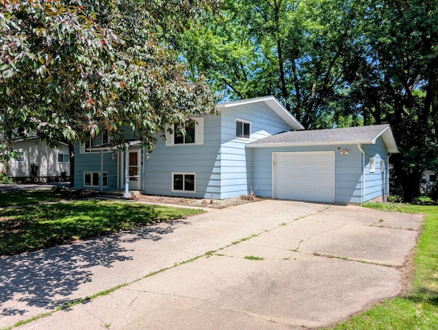 314 11th St, Montevideo, MN 56265 - view of front of house featuring a garage, concrete driveway, a front lawn, and a shingled roof