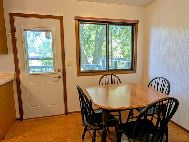 314 11th St, Montevideo, MN 56265 - dining room with plenty of natural light, light wood-type flooring, and wallpapered walls