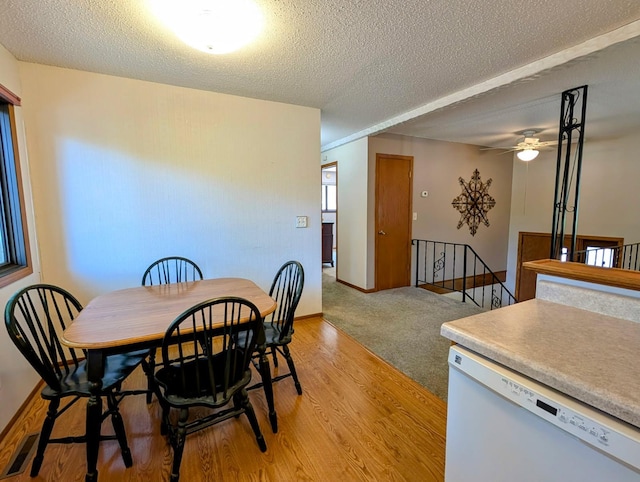 314 11th St, Montevideo, MN 56265 - dining room with a textured ceiling, light wood-style floors, and a ceiling fan