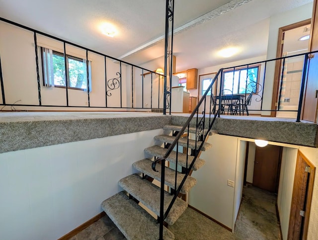 314 11th St, Montevideo, MN 56265 - staircase featuring plenty of natural light