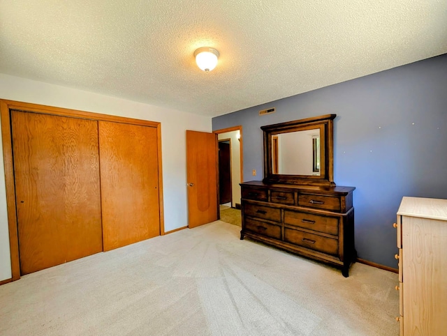 314 11th St, Montevideo, MN 56265 - carpeted bedroom with a closet and a textured ceiling