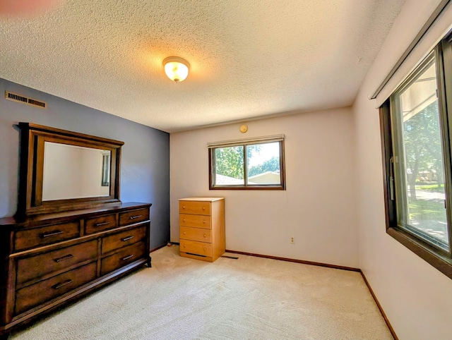 314 11th St, Montevideo, MN 56265 - bedroom featuring light colored carpet and a textured ceiling
