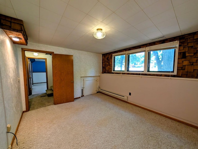 314 11th St, Montevideo, MN 56265 - carpeted spare room featuring a baseboard heating unit and baseboards