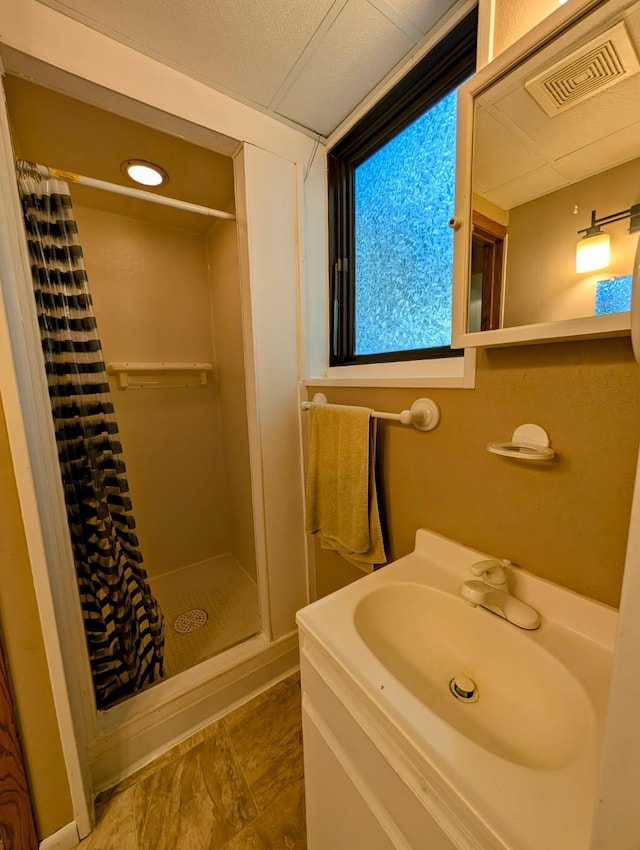314 11th St, Montevideo, MN 56265 - full bathroom featuring a stall shower and vanity