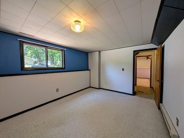 314 11th St, Montevideo, MN 56265 - unfurnished room featuring a baseboard heating unit and light colored carpet