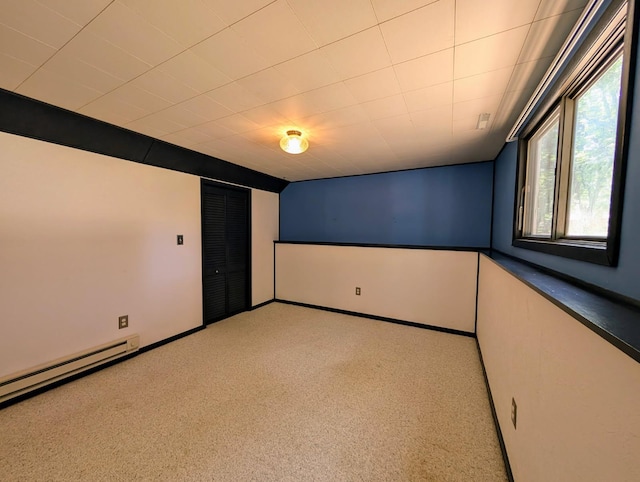 314 11th St, Montevideo, MN 56265 - unfurnished bedroom with carpet floors, a closet, and a baseboard radiator