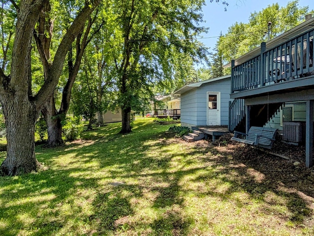 314 11th St, Montevideo, MN 56265 - view of green lawn featuring a deck
