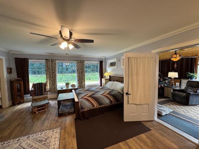 14717 State 210, Stowe Prairie Twp, MN 56453 - bedroom featuring crown molding, wood finished floors, multiple windows, and ceiling fan