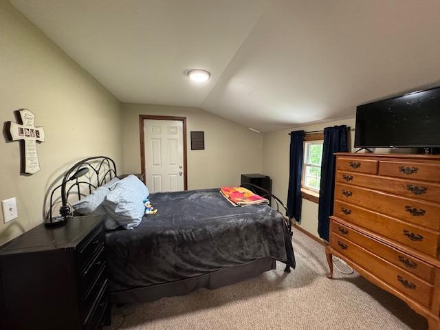 14717 State 210, Stowe Prairie Twp, MN 56453 - bedroom featuring vaulted ceiling and light carpet
