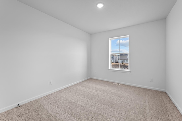unfurnished room with carpet floors and recessed lighting