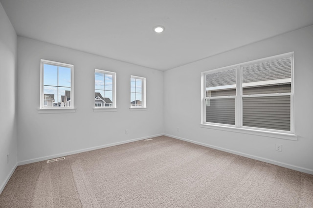 unfurnished room featuring carpet and recessed lighting