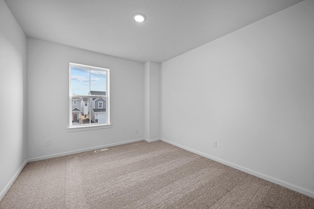 empty room featuring carpet floors and recessed lighting