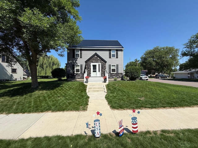 411 Vernon Ave, Morgan, MN 56266 - view of front of house with a front lawn and a metal roof