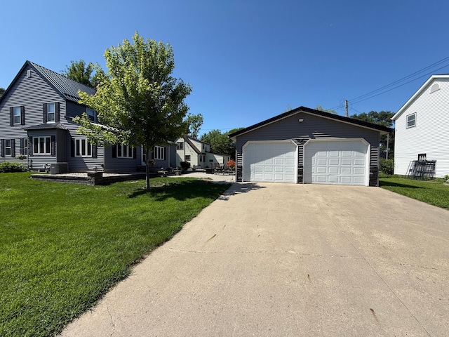 411 Vernon Ave, Morgan, MN 56266 - view of property exterior featuring an outdoor structure, a yard, and a garage