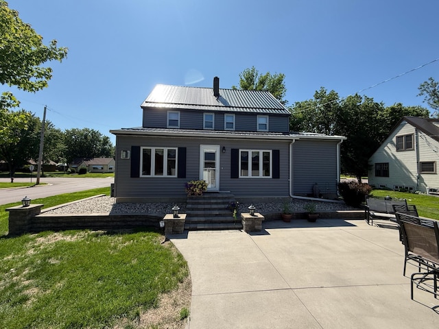 411 Vernon Ave, Morgan, MN 56266 - view of front of property featuring a front yard, a metal roof, and a patio