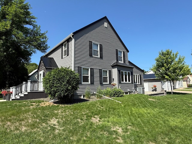 411 Vernon Ave, Morgan, MN 56266 - view of side of property with a central air condition unit and a lawn