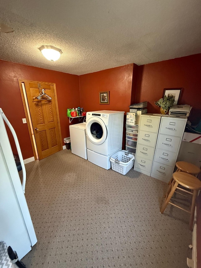 411 Vernon Ave, Morgan, MN 56266 - laundry area featuring washer and clothes dryer, a textured ceiling, and carpet floors
